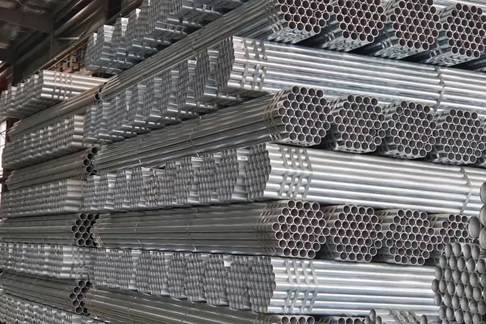 high quality galvanized steel pipes stacked in a warehouse for construction and industrial applications.